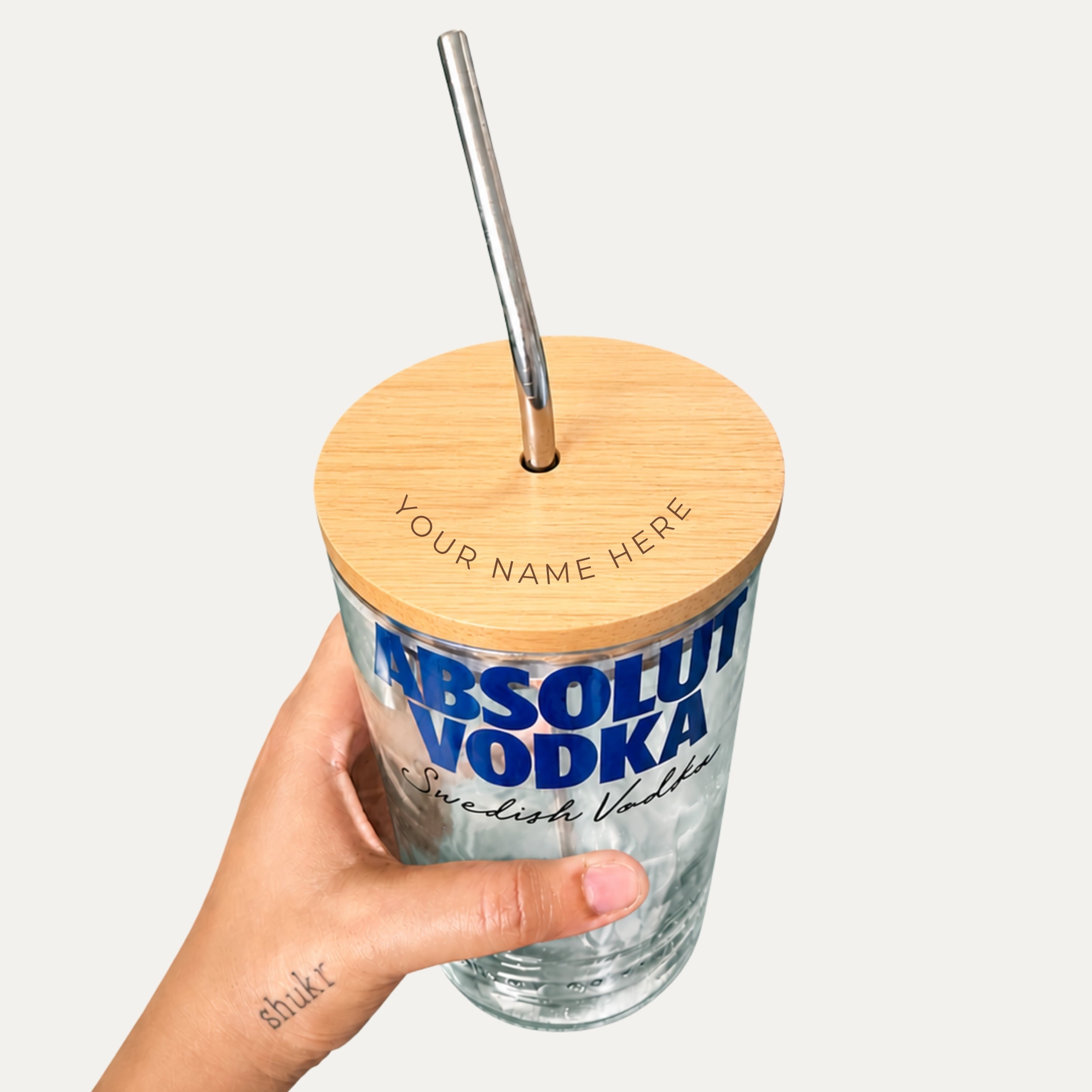 Customized engraved Absolut sipper glass from Kavi The Poetry-Art Project drinkware set with artistic design.