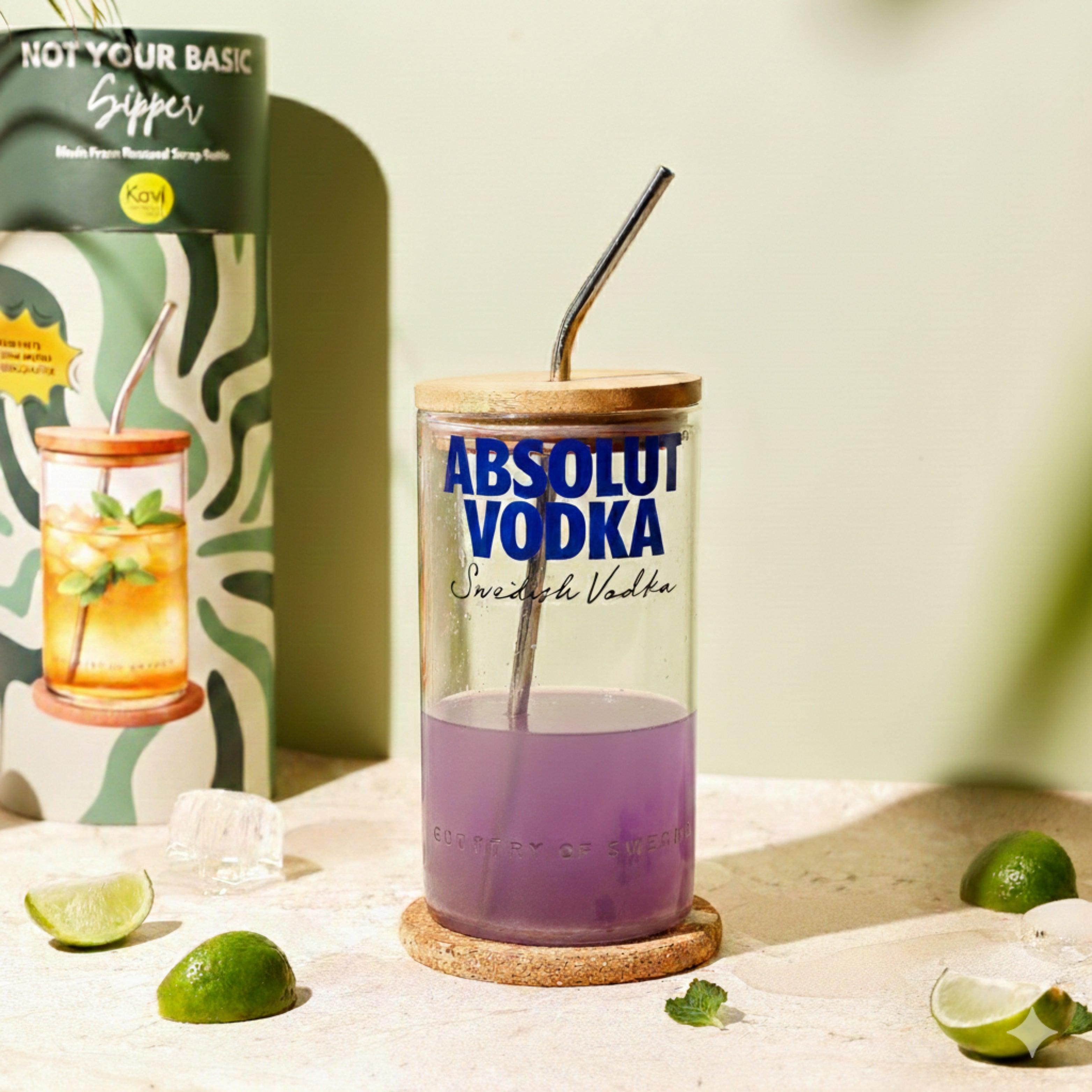 Kavi Upcycled Absolut Tall Glass drinkware with a sleek design, perfect for serving beverages in a stylish, artistic way.