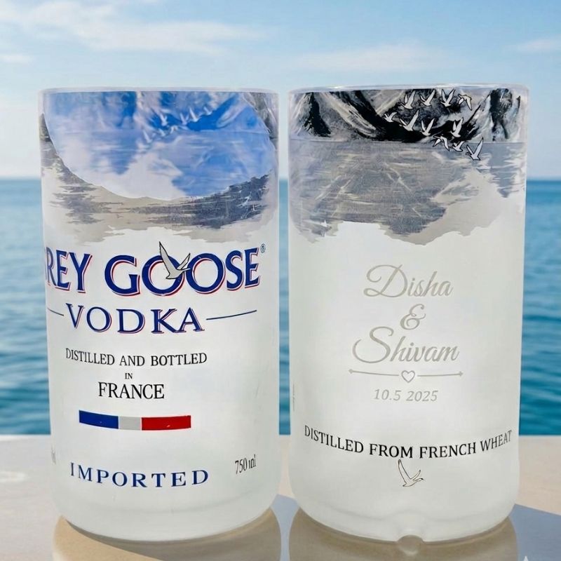 Customized engraved Grey Goose bottle glasses from Kavi The Poetry-Art Project, part of the drinkware set with intricate designs.