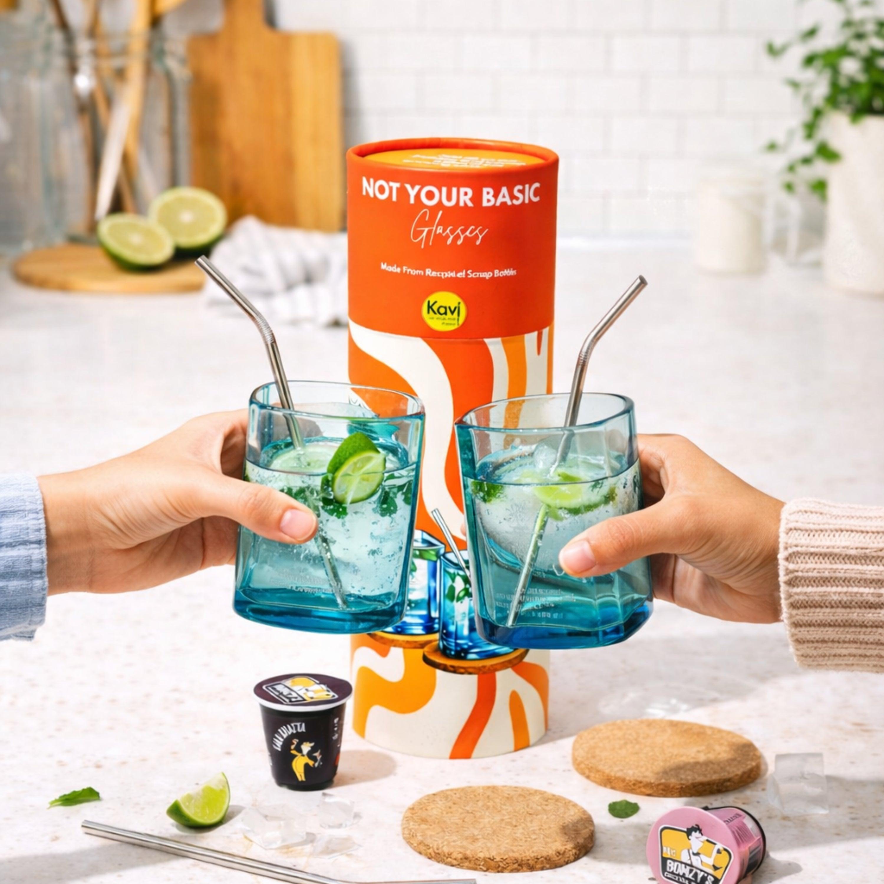 Two people holding blue glasses with lime slices and straws, with a Kavi product in the background.